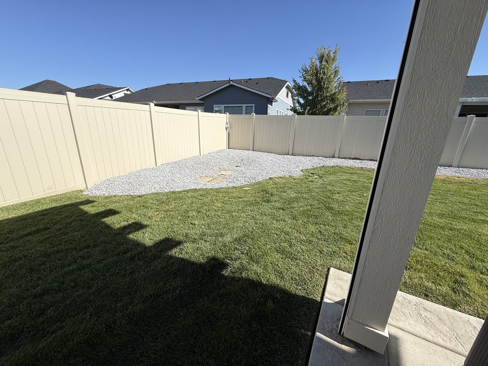 Finished backyard beds with blue gravel — Meridian Idaho